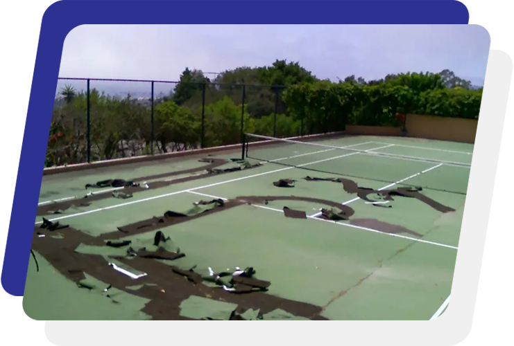 A tennis court with many holes in it