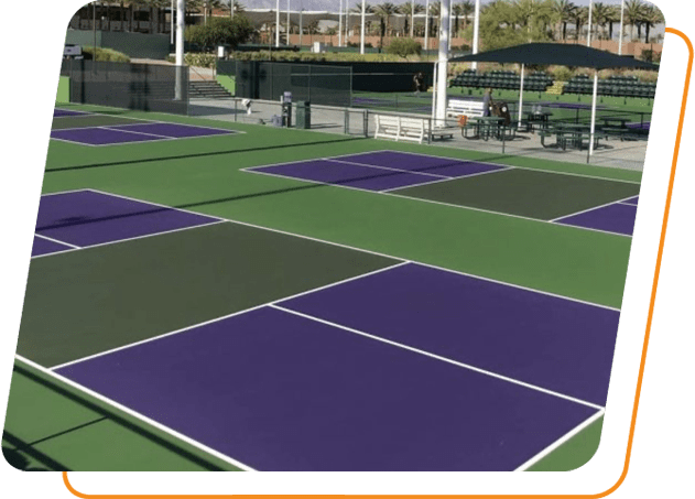 A tennis court with many different colors of green and purple.